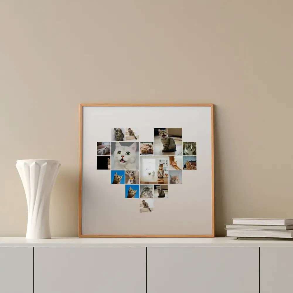 Pêle-mêle de photos de chats en cœur, cadre en bois naturel posé sur un buffet près d’un vase blanc et de livres