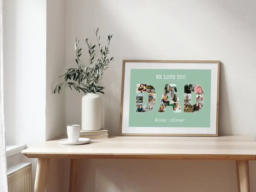 Collage photo pour papa en lettres, cadre en bois et passe-partout blanc, posé sur un bureau près d’un vase